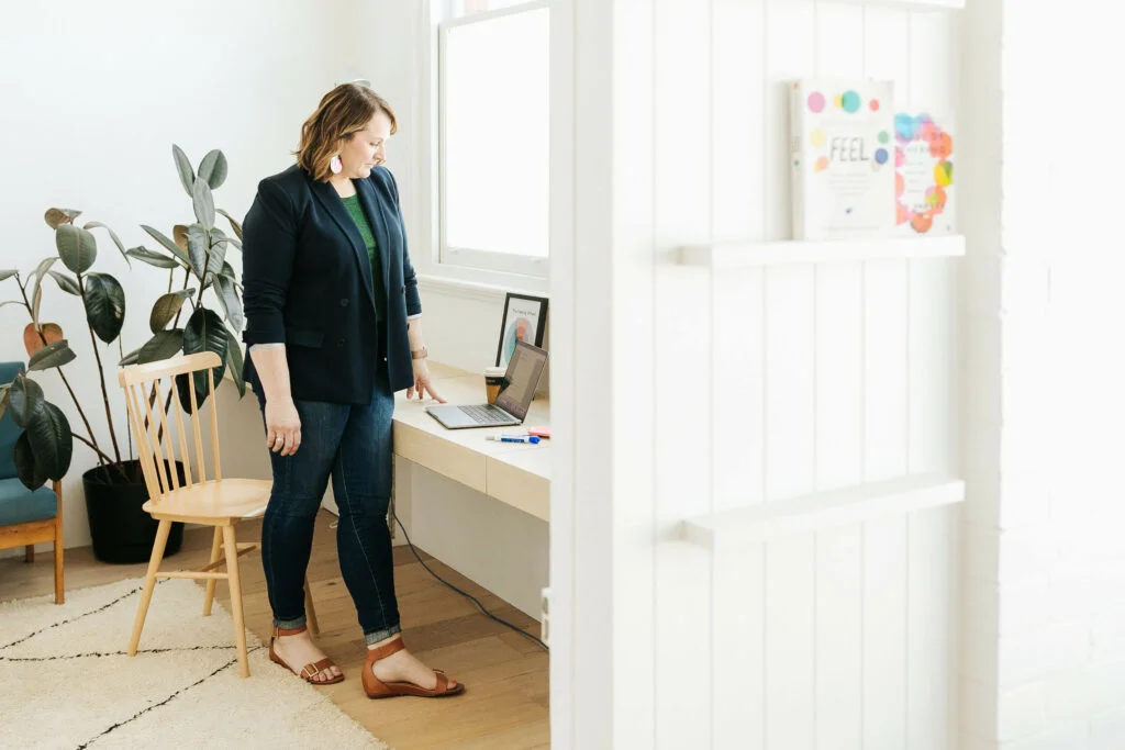 Lorissa-standing at desk look at computer